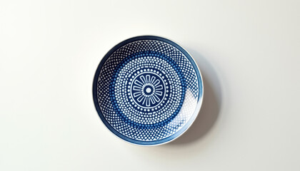 Blue and white ceramic plate with circular pattern for table setting, wall decor, dining presentation, kitchen styling, and decorative home accents