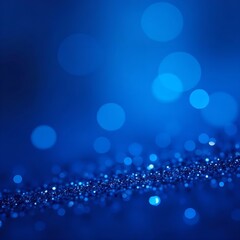 Abstract royal blue background with glitter bokeh. Shimmering sapphire crystals create dreamy texture. Light, sparkle create magical effect. Perfect for holiday, party luxury product presentation