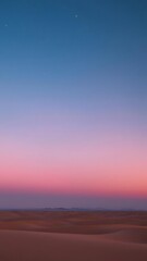Obraz premium Desert Sky at Night with a Soft Pink to Blue Gradient and Stars Sparkling Above