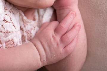 Little newborn baby hands and fingers delicate close up