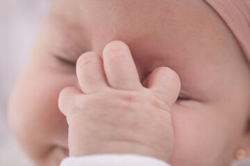 Little newborn baby hands and fingers delicate close up