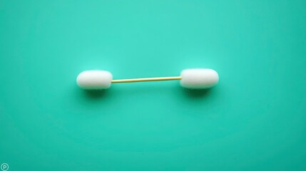 Cotton Swab on a Vibrant Aqua Background for Health and Hygiene