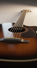 Fototapeta premium Acoustic guitar strings and body close up in warm light musical art