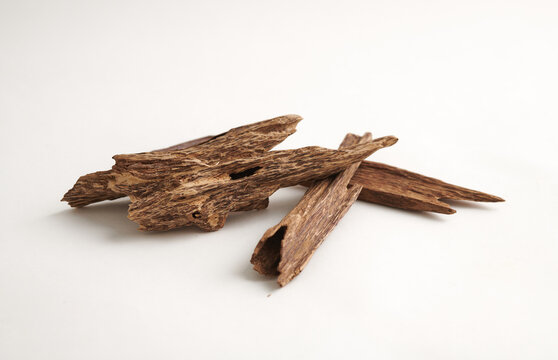 Close-Up of Agarwood (Oud) Sticks isolated on white background &ndash; Precious Aromatic Wood