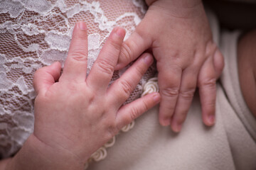 Little newborn baby hands and fingers delicate close up