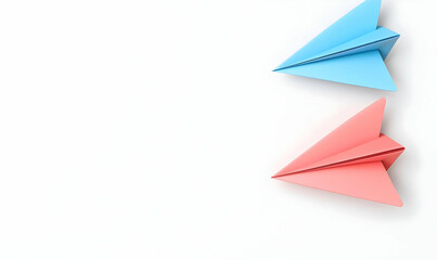 Colorful Paper Airplanes in Blue and Pink on White Background