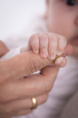 Little newborn baby hands and fingers delicate close up