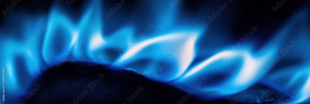 Poster bright blue gas flame burning intensely in a close up view showcasing its vibrant hues and energy dy