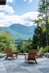 Obraz premium A patio overlooking a serene mountain range with Adirondack chairs