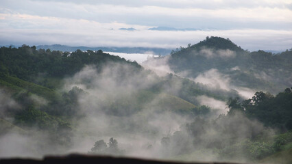 Landscape view of greenery mountains on foggy morning