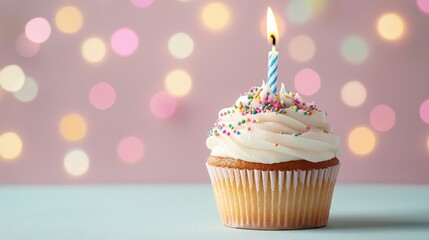 Freshly Baked Cupcake with Colorful Sprinkles and One Candle Against a Soft Bokeh Background