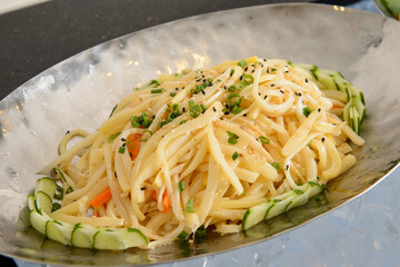 Bellflower and cucumber salad on a silver plate
