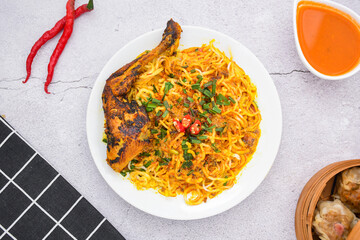 curry laksa with rice noodles and chicken. Laksa is a type of noodle dish with spices typical of Peranakan culture that combines Chinese and Malay. Asian traditional soup.
