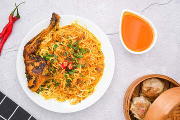 curry laksa with rice noodles and chicken. Laksa is a type of noodle dish with spices typical of Peranakan culture that combines Chinese and Malay. Asian traditional soup.