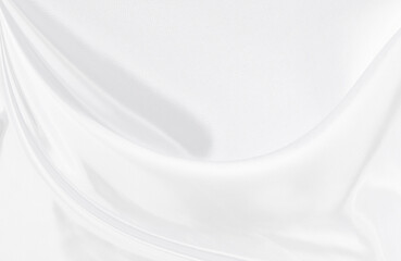 White gray satin texture that is white silver fabric silk background with beautiful soft blur pattern natural.
