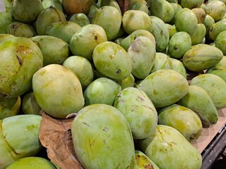 green mangoes in the market