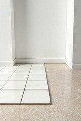 Clean White Tiles Meet Light Beige Flooring in a Modern Interior Space
