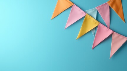 Colorful Triangular Flags Against a Teal Background