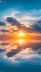 Fototapeta premium Dramatic sunset reflecting in calm water with interesting clouds