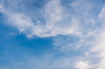 Cirrus cloud with sunset light over blue sky.  nature wallpaper  background.
