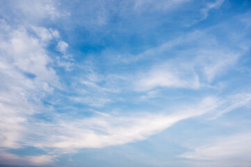 Obraz premium Cirrus cloud with sunset light over blue sky. nature wallpaper background.