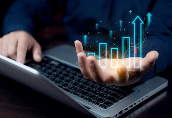 Holding a digital marketing growth graph, analyzing business planning, and conducting financial research on the global network connection. business strategy and economic growth.