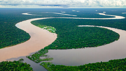 Aerial View of the Majestic Amazon River Meandering Through Lush Rainforest in the Amazon Region