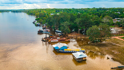 Aerial View of Amazon River with Boats and Lush Greenery in Amazonas Region