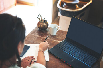 Laptop, writing and woman with notes for creative business for planning, inspiration and ideas....
