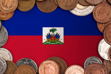Coins on flag of Haiti. trading investment business currency concept
