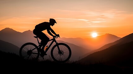 Fototapeta premium Silhouetted Cyclist Riding on Hill at Dramatic Sunrise or Sunset with Vibrant Sky