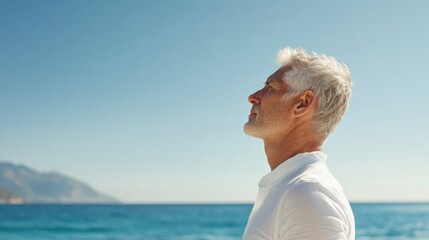 Hypertension patient taking a deep breath by the ocean. Featuring mindfulness and stress relief