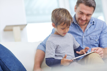 Education, learning or tablet with father and son on sofa in living room together for bonding or...