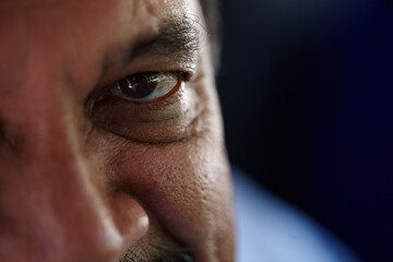 Senior man, eye and portrait in closeup for healthy vision, optometry or wellness in retirement. Elderly person, face and zoom with pupil, retina and eyesight with space, glaucoma or lens in Malaysia