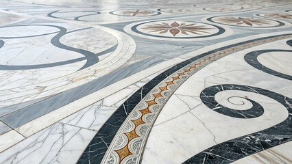 A close-up of an abstract marble pattern on a marble stone floor.