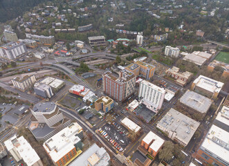 Fototapeta premium A city view with a lot of buildings and cars