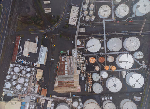 A large industrial area with many tanks and a lot of white