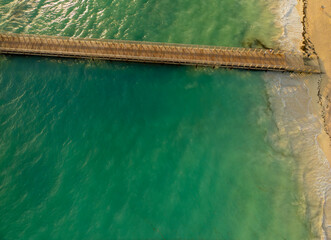The water is calm and the sky is clear