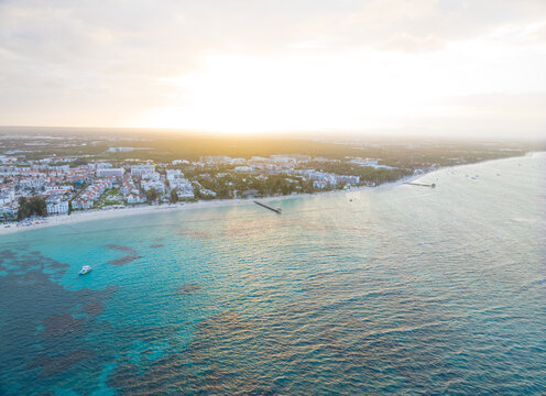 A beautiful blue ocean with a city in the background