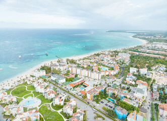 A beach town with a lot of buildings and a large body of water