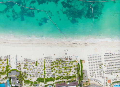 A beach with a resort in the background