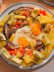 Sunny side up eggs with vegetables for breakfast. Delicious food.Cooking recipes. Healthy meal.Diet food.Healthy recipes.Diet food dish. Protein egg. Cozy time.