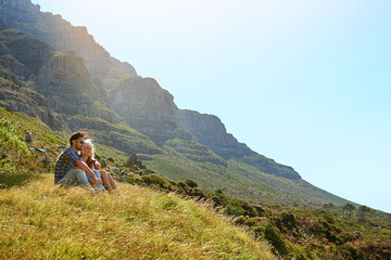 View, smile and love with couple in nature for bonding, park conservation date and mountain space. Happiness, holiday and peace with man and woman in grass field for vacation, commitment and trust