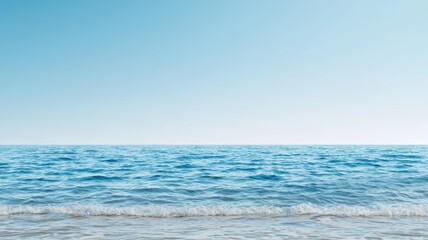 Obraz premium Calm ocean waves under a clear blue sky, perfect for nature and tranquility themed projects.