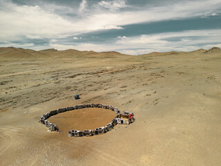 The local tribes of Mongolia made a pen for animals from the body of cars. Car recycling. A...