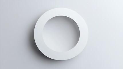 Simple white circle design on a neutral background.