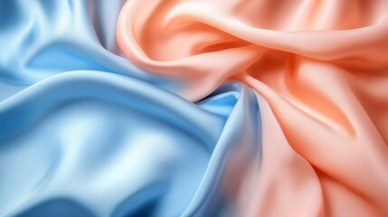 Obraz premium Flowing fabric in soft blue and peach hues, creating a calming and elegant texture. Textile and design concept