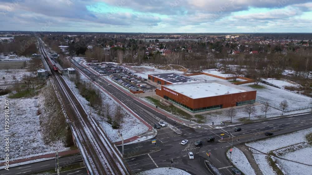 Aufkleber train traveling through a snowy cityscape in segefeld falkensee. amazing aerial view flight static t