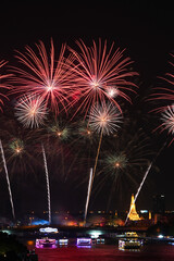 View of Bangkok, Thailand at night, with the Chao Phraya River, beautiful fireworks and boats. Photo taken on 22 Dec 2023.