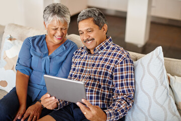 Senior, social media and tablet with couple on sofa in living room of home together for bonding or...